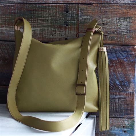 olive green leather crossbody bag.